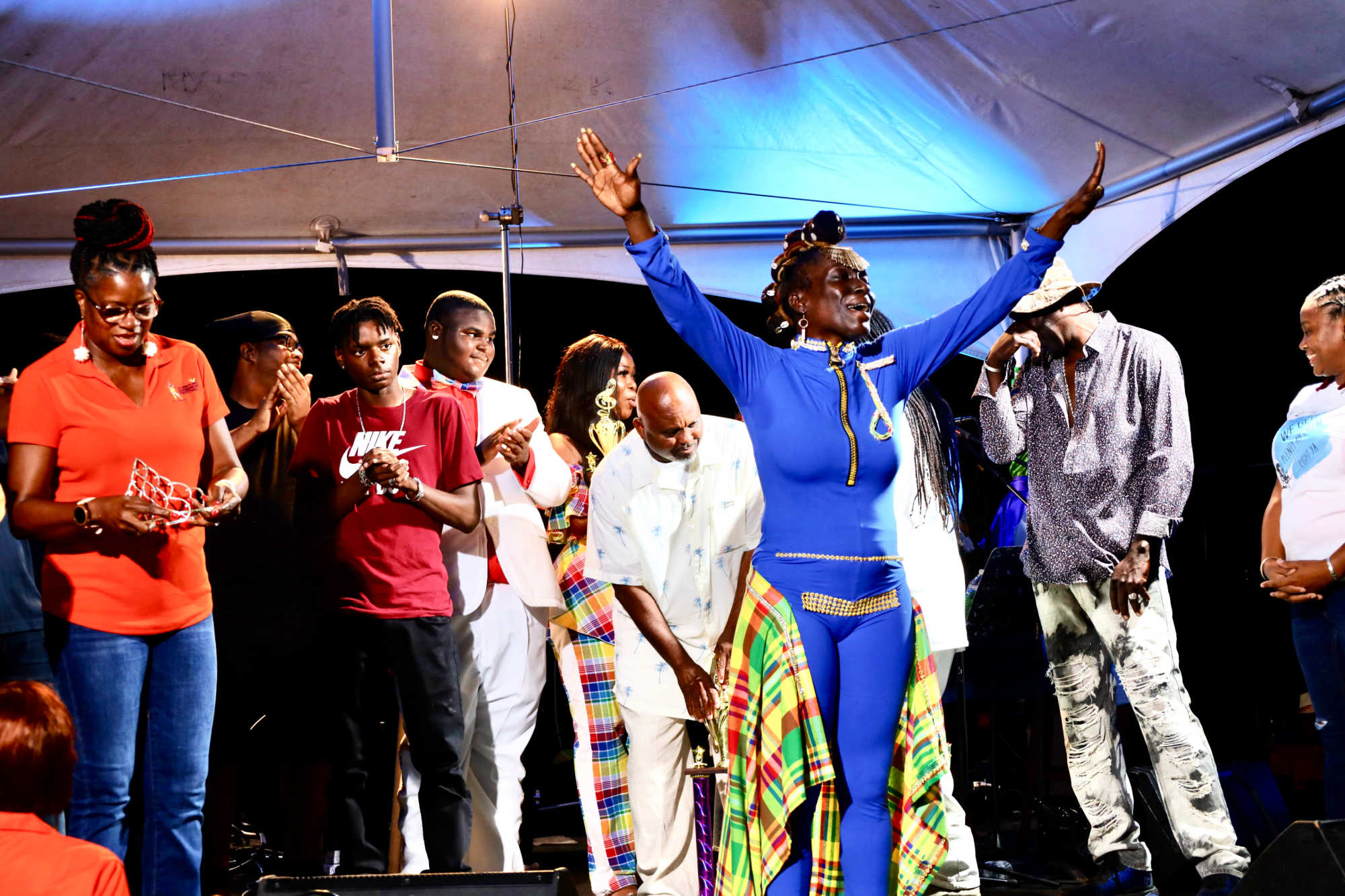 Blackness raises her hands in victory after winning the 2022-2023 St. Croix Calypso Monarch.