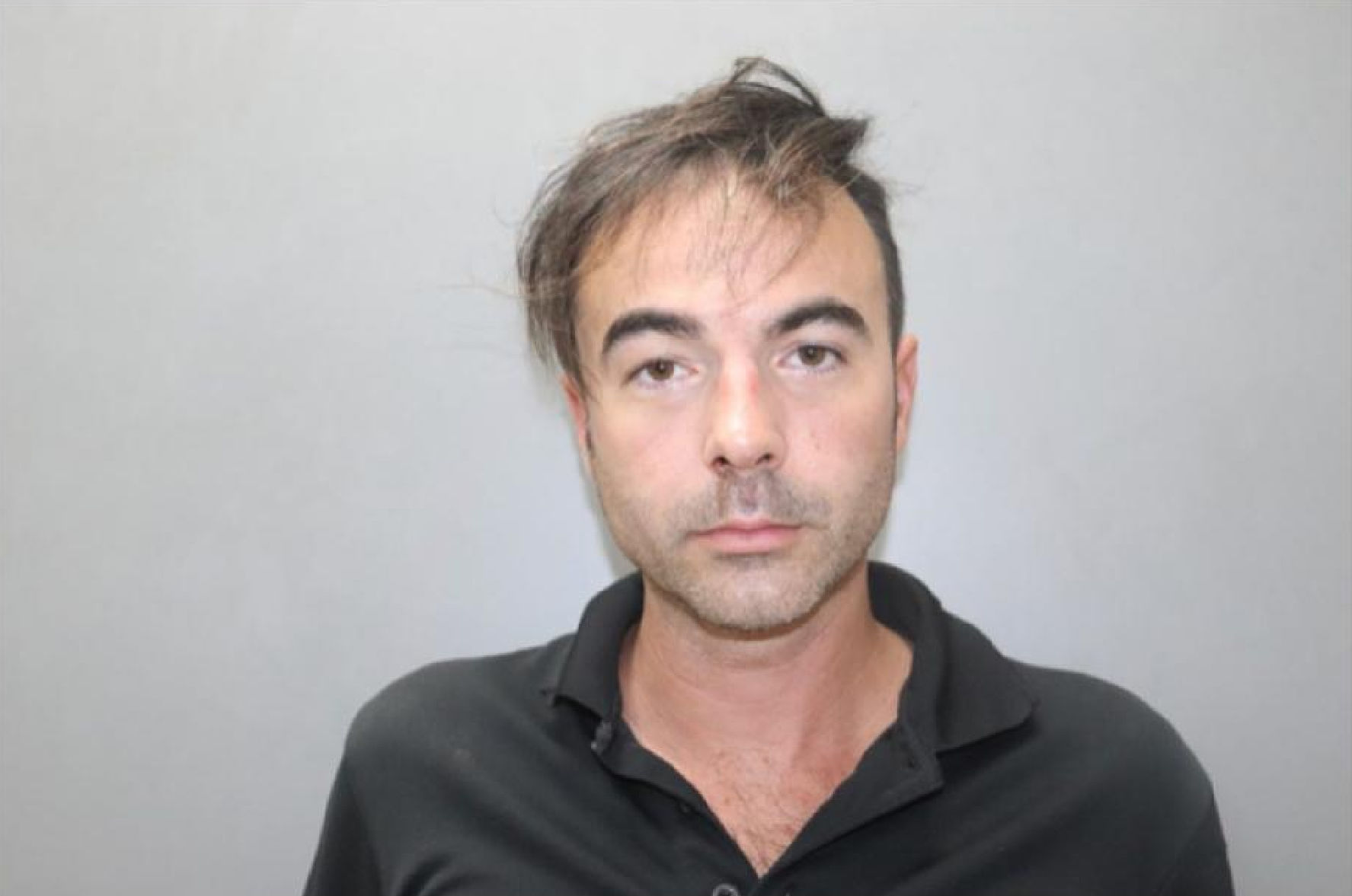 Mugshot of Brett Grady.