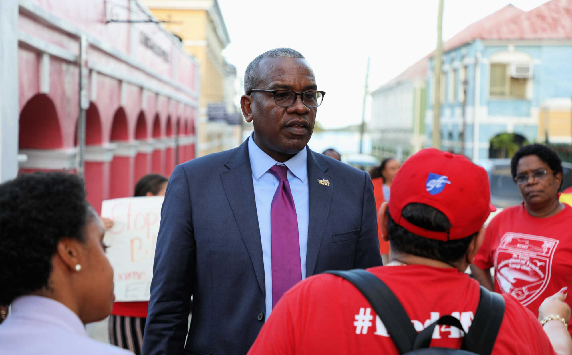 Governor Bryan discusses school maintenance with members of AFT Local 1826 outside Government House in Christiansted.