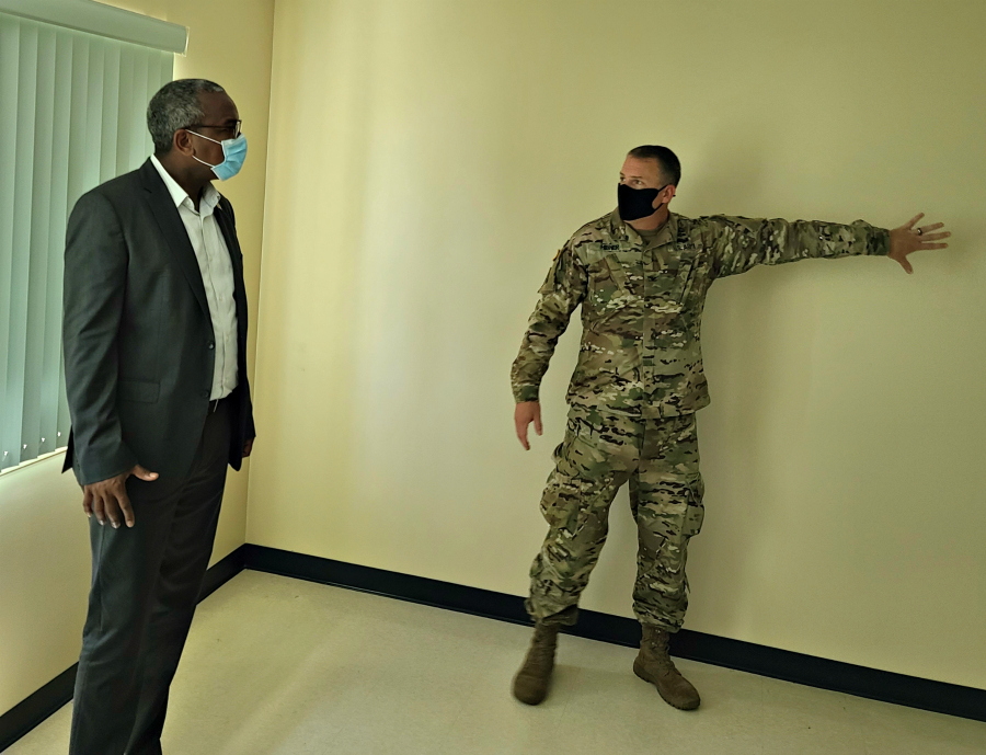 Army Corps of Engineers Savannah District Commander, Col. Daniel H. Hibner, gives Governor Bryan a tour of a facility at the National Guard on St. Croix being prepared for coronavirus patients.
