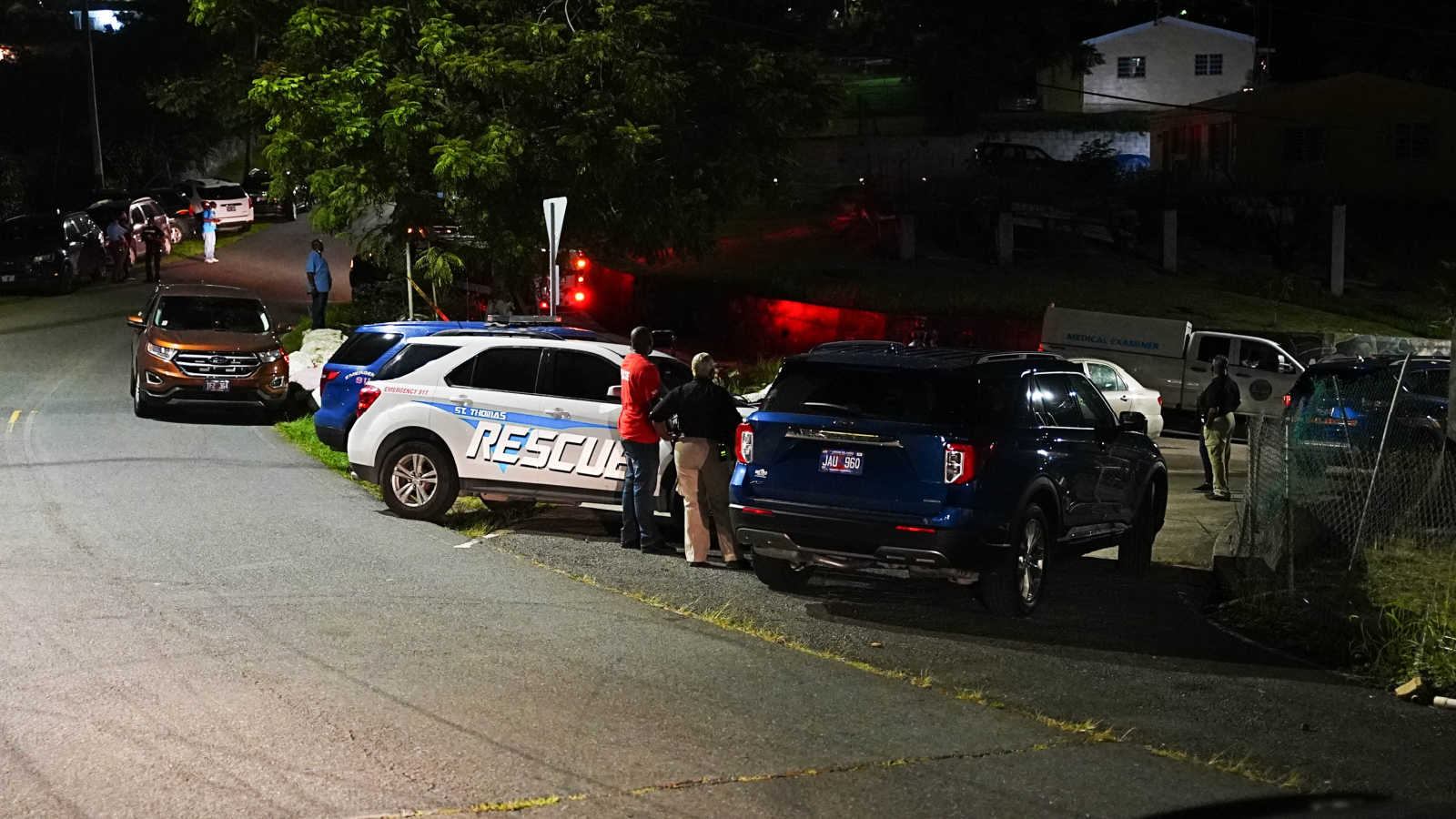 Police officers, St. Thomas Rescue and employees of the Medical Examiner’s Office in Estate Fortuna, where 38-year-old Donald George was found dead of a gunshot wound.