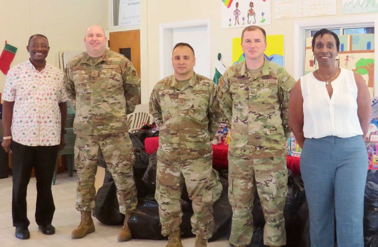 Hurricane Hunters 403 Maintenance Group deliver gifts to Queen Louise Home for Children on Dec. 6, 2022.