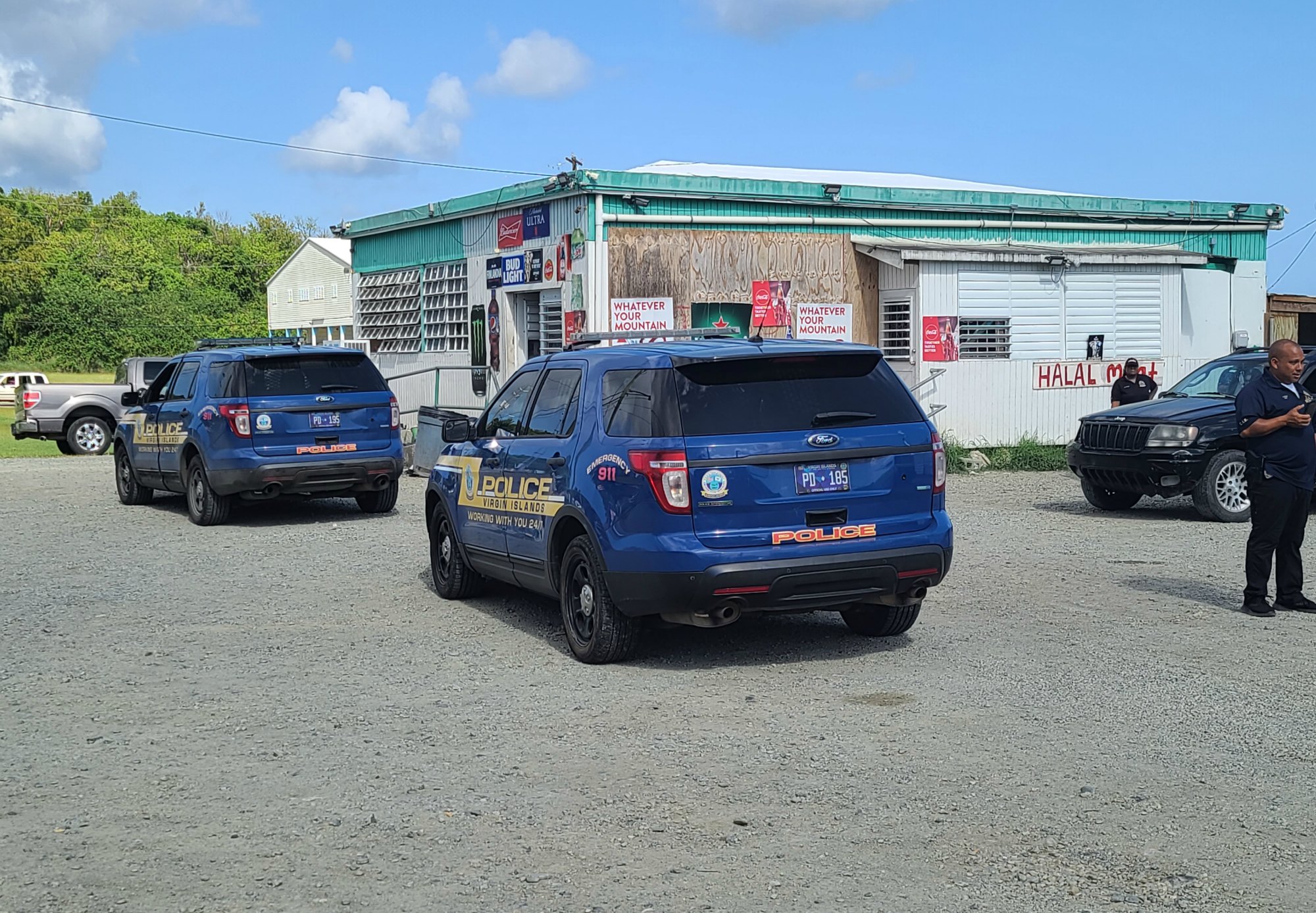 Police investigate incident at Cash & Carry Store in Estate La Reine on Monday afternoon.