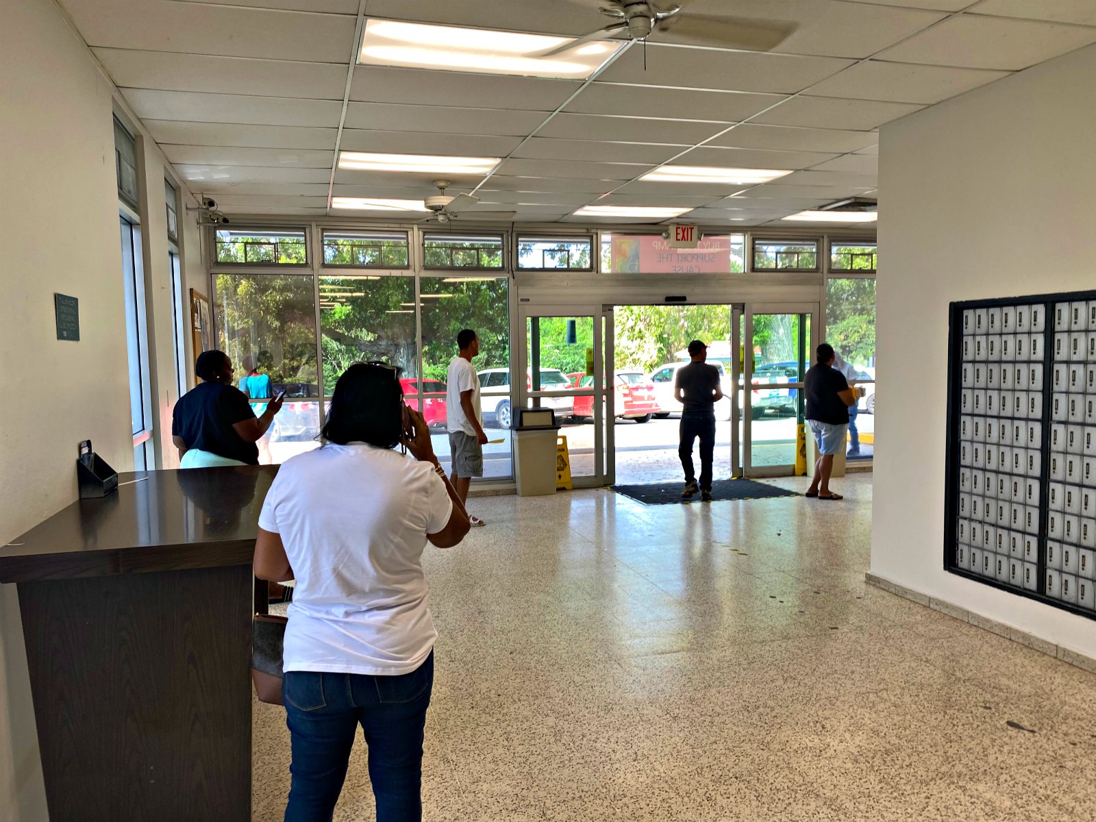 St. Croix residents practice social distancing at the Kings Hill Post Office on Monday, March 23.