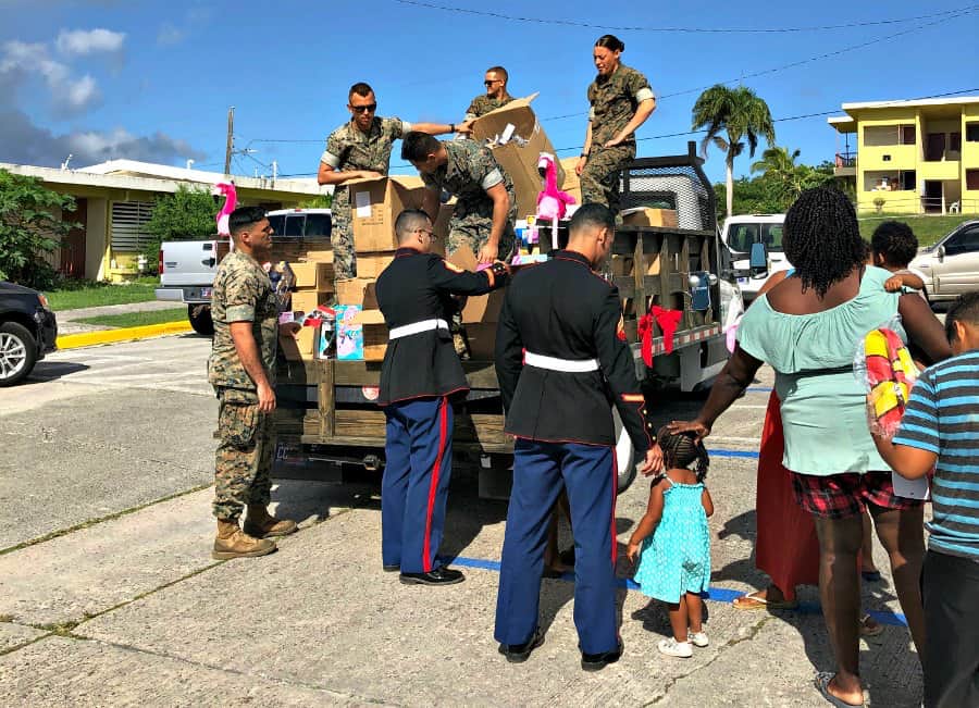 Marines distribute holiday gifts to children across the territory.