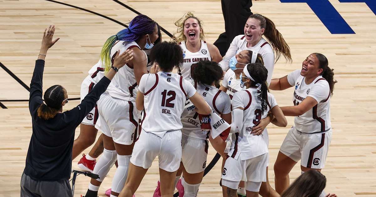 South Carolina Gamecocks celebrate after they routed Texas to reach their third Final Four.