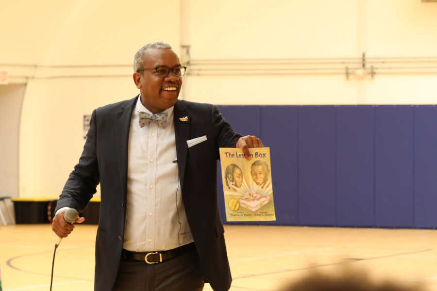 Governor Albert Bryan Jr speaks to students at the kick-off rally for the 2019 Governor's Summer Reading Challenge at the Arthur A. Richards K-8 School on St. Croix.