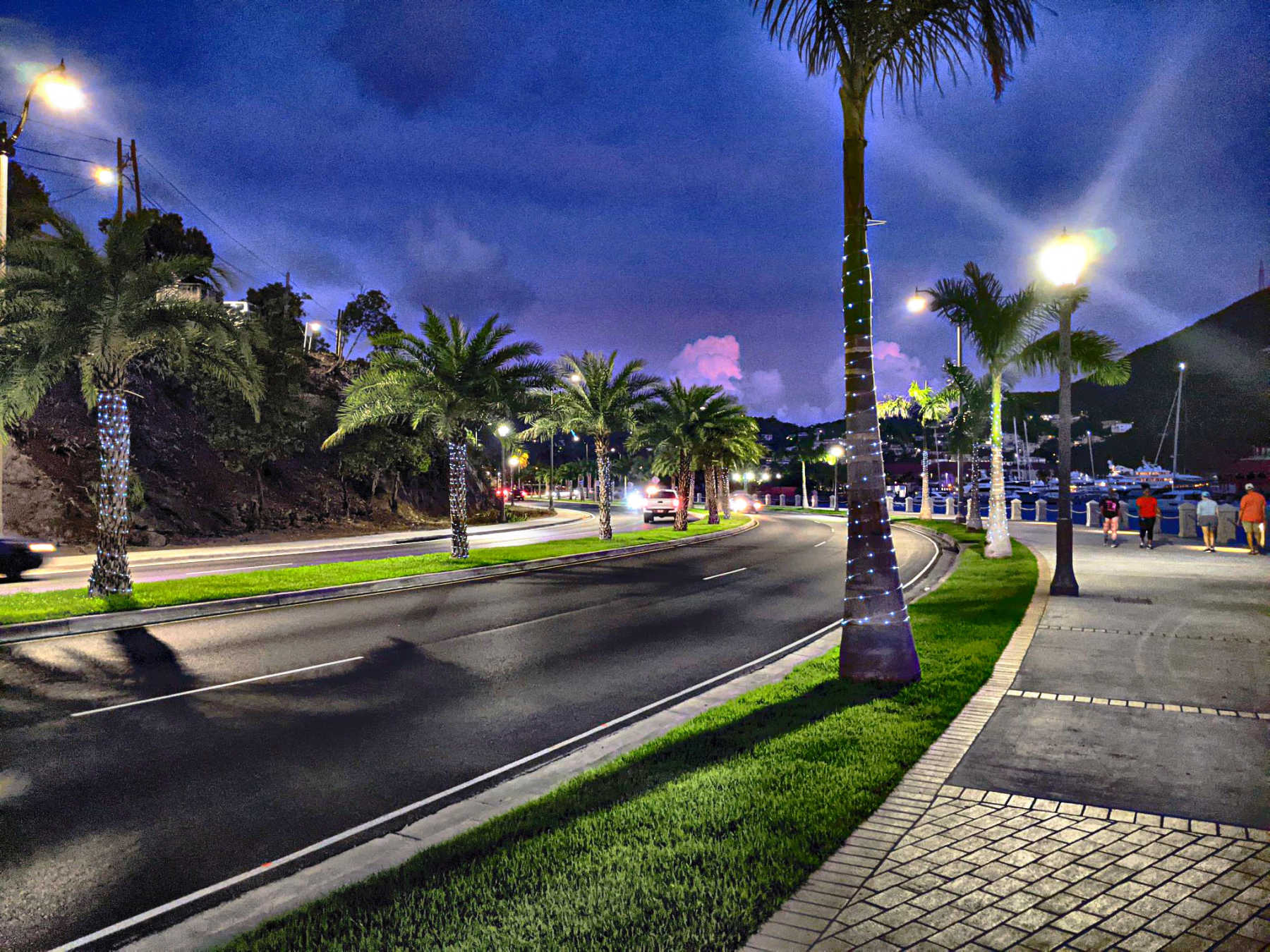 The 90 palm trees lining the newly constructed Veterans Drive brighten the roadway at nights with over 10,000 solar-powered lights sponsored by Oriental Bank.