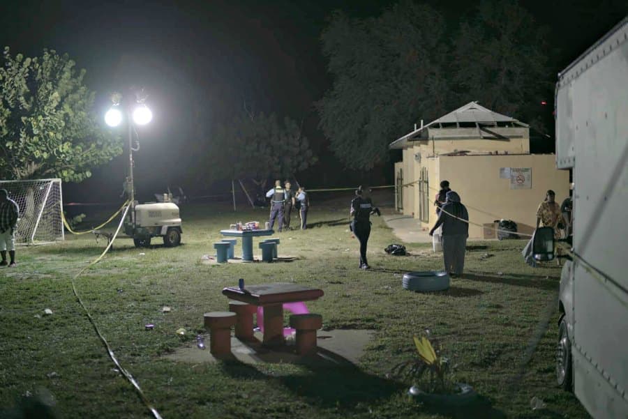 Scene at Fort Frederik Beach area following the shooting at Floatopia that left 6 people injured .