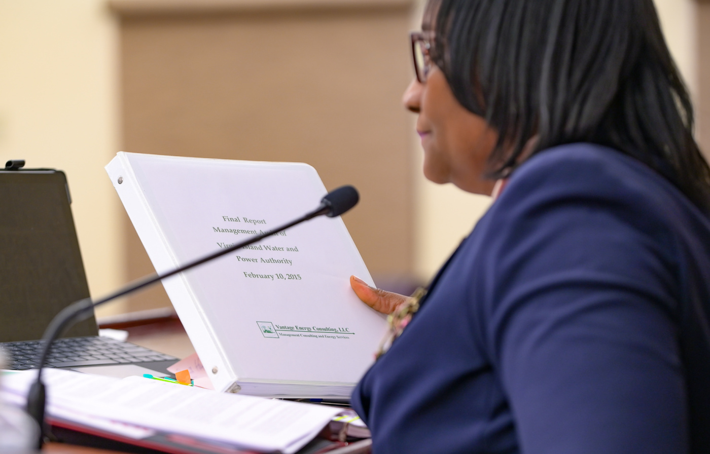 Senate President Donna Frett-Gregory holding up a WAPA management audit