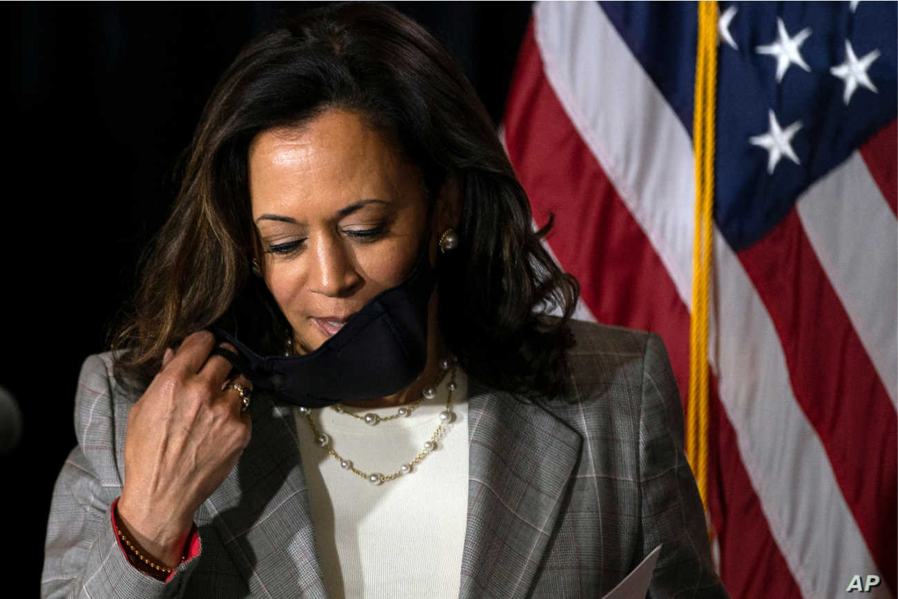 Correction: Harris suspends travel after staffer tests COVID-19 positive