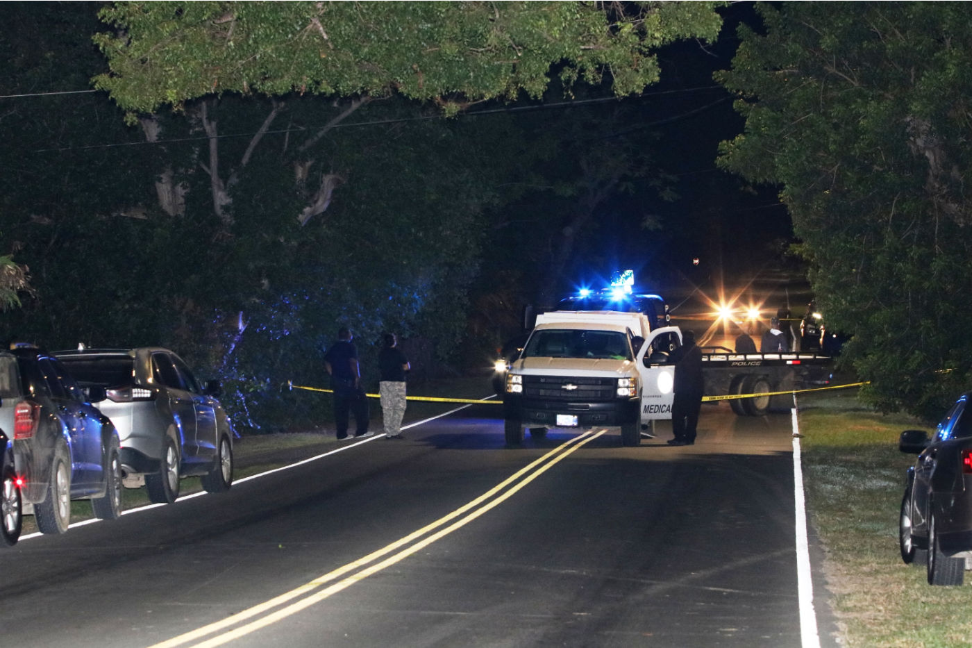 Detectives and staff from the Medical Examiner’s Office at the scene of a shooting incident in Estate Whim that left one man injured and another man dead.