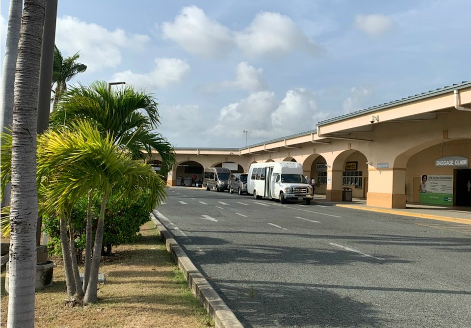 Shuttles await Limetree Bay workers who arrived via plane to St. Croix on Wednesday, May 6, 2020