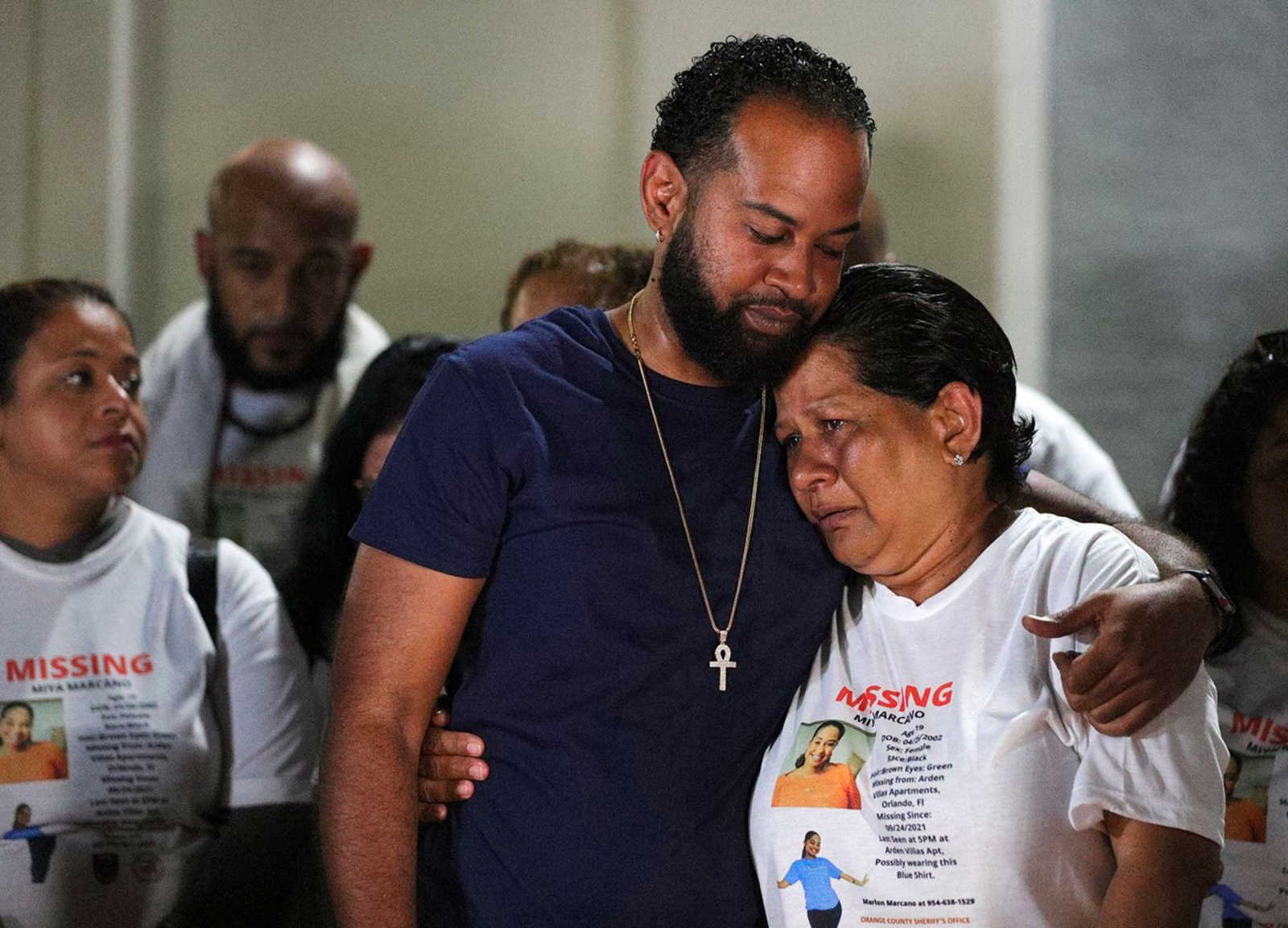 Members of Miya Marcano's family, among them her father Marlon Marcano, center left, host a candlelight vigil at Arden Villas, on Oct. 1, 2021, in Orlando, Fla.