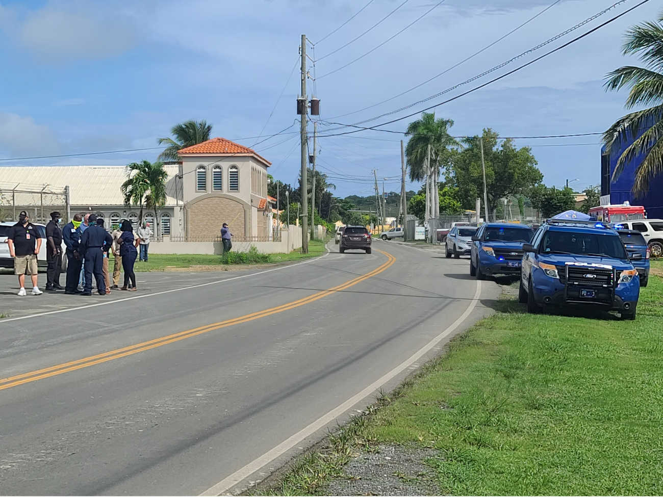 Police officers and Limetree Bay representatives discuss the DOA incident Wednesday morning.