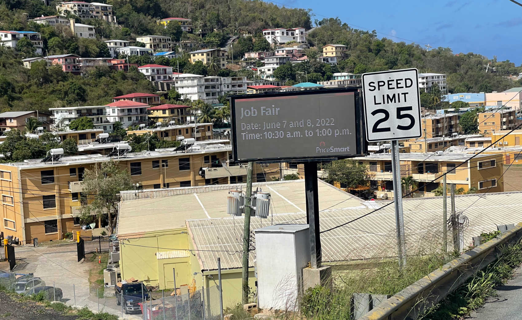 A billboard from a company called Smart Signs in St. Thomas.