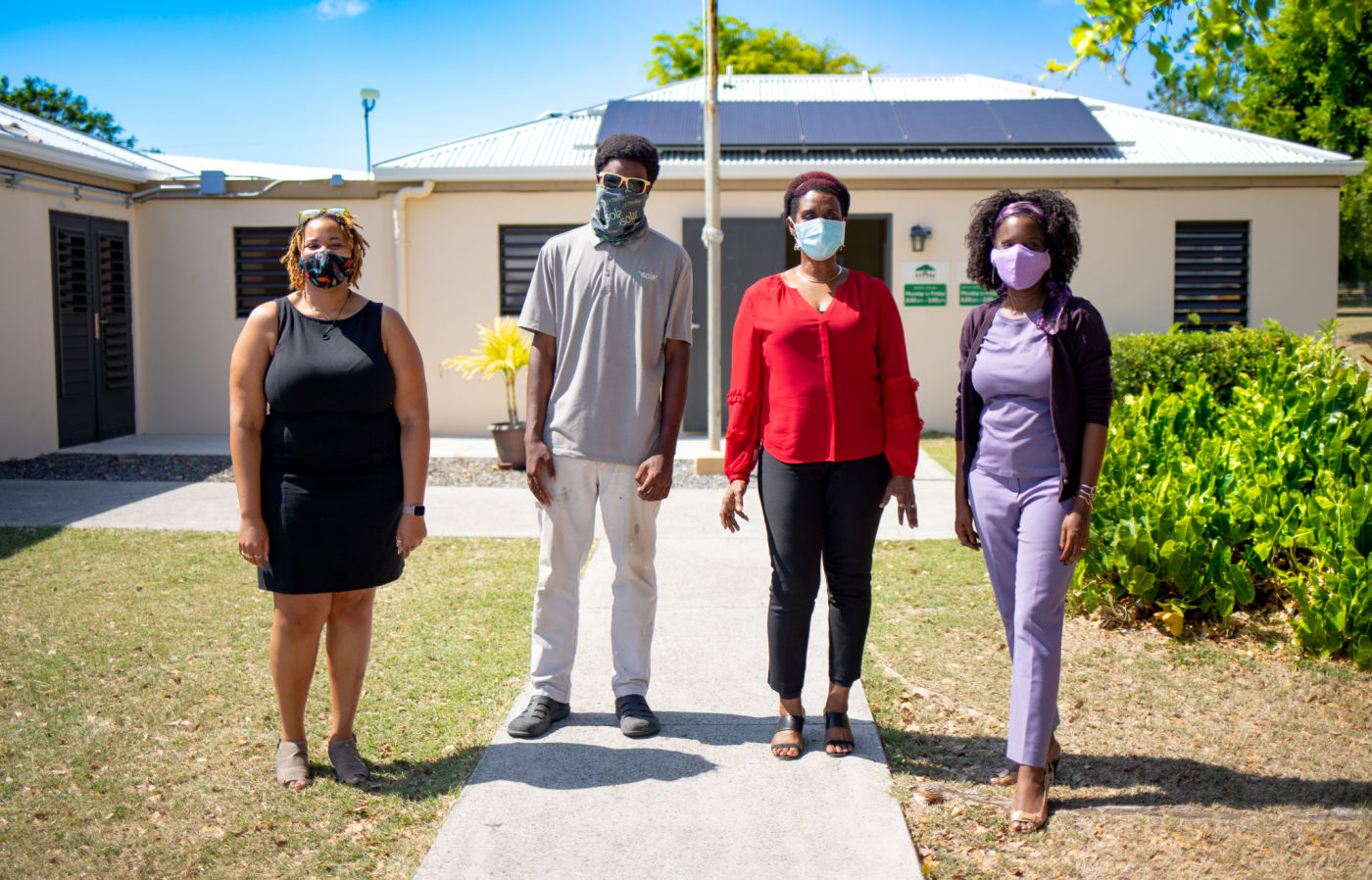 From left: Essence Carter, STX Foundation executive assistant, Titus Promise, solar installer, Junia John-Straker, Lutheran Services V.I. CEO, and Deanna James, STX Foundation president.