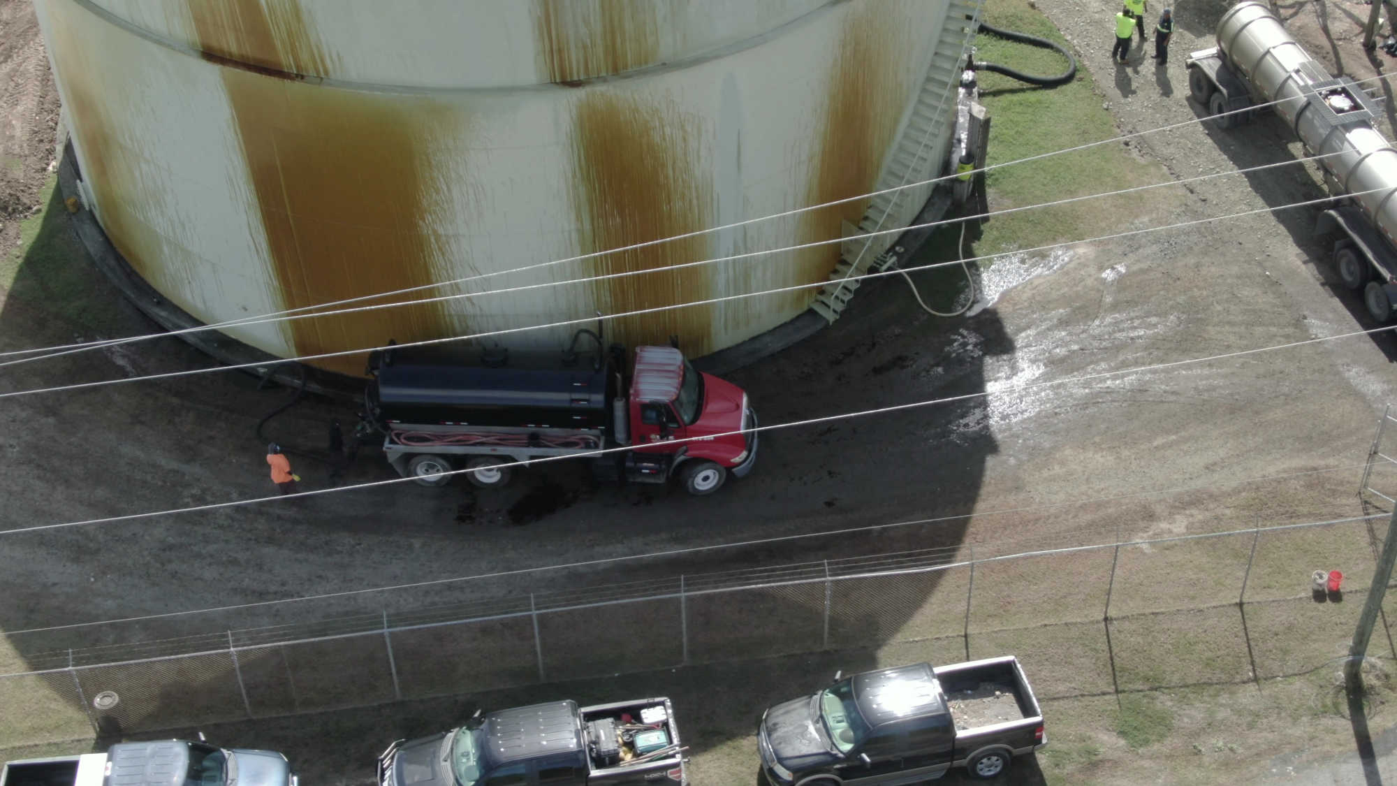 A vacuum truck is seen collecting spilled molasses at the Cruzan Rum site at the Gordon Finch Molasses Pier on St. Croix.