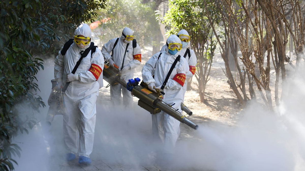Members of a police sanitation team spraying disinfectant to quell the spread of the coronavirus in Bozhou, in China’s eastern Anhui province.