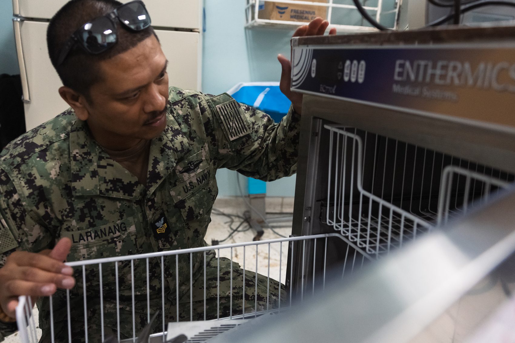 A U.S. Navy corpsman checks a fluid warmer at Kingston Public Hospital in July 2024. Archival photo from Continuing Promise 2024.