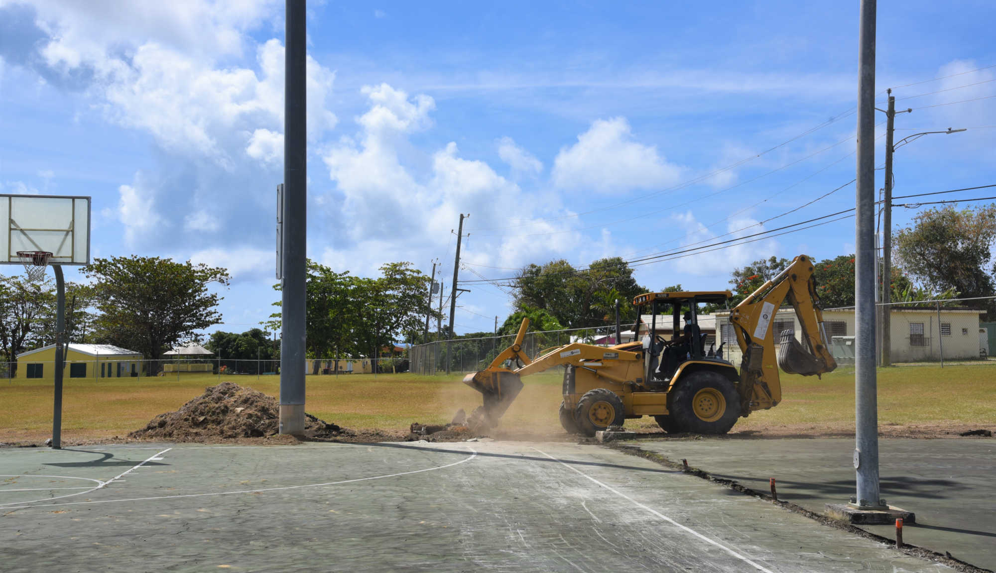 Archive photo shows improvement work at Isaac Boynes Ballpark in Frederiksted, where a donated scoreboard remains uninstalled as lawmakers question whether government processes are discouraging private assistance.