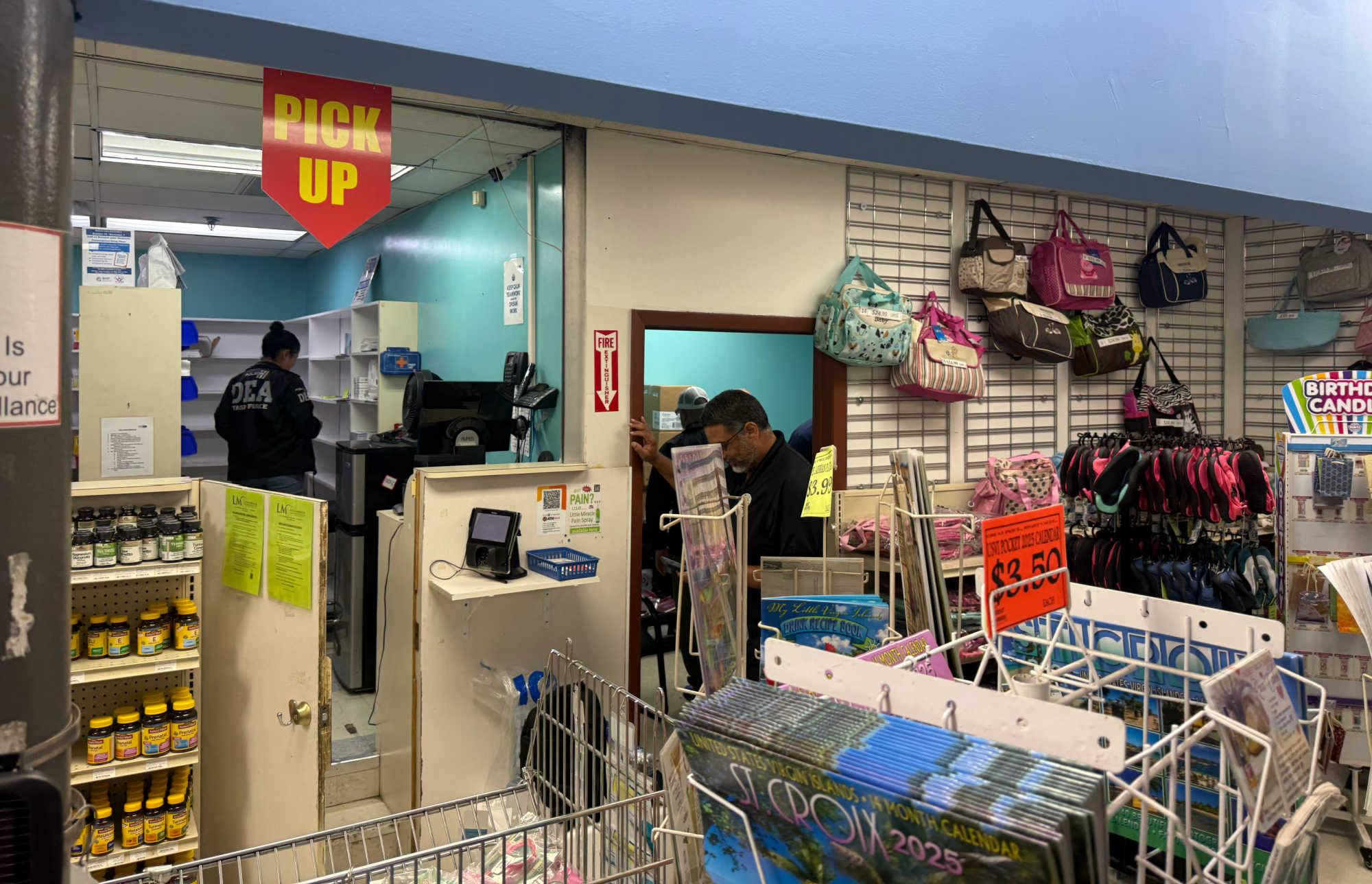 Federal agents are seen inside Doctor’s Choice Pharmacy, a tenant located within Plaza Extra East, during a DEA enforcement action conducted Thursday on St. Croix.