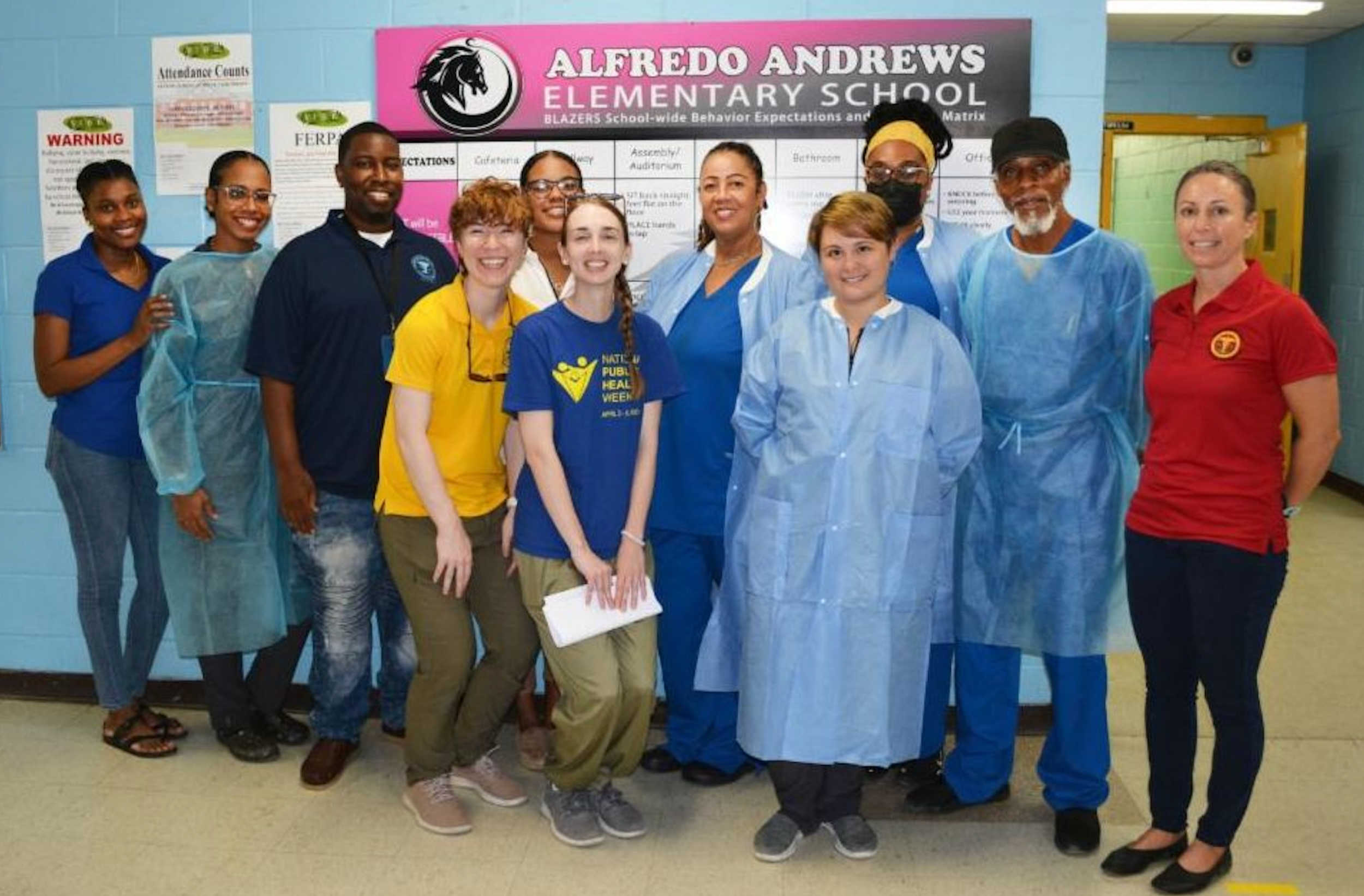 Members of the Epidemiology Division team at Alfredo Andrews School during the 2024 lead event.