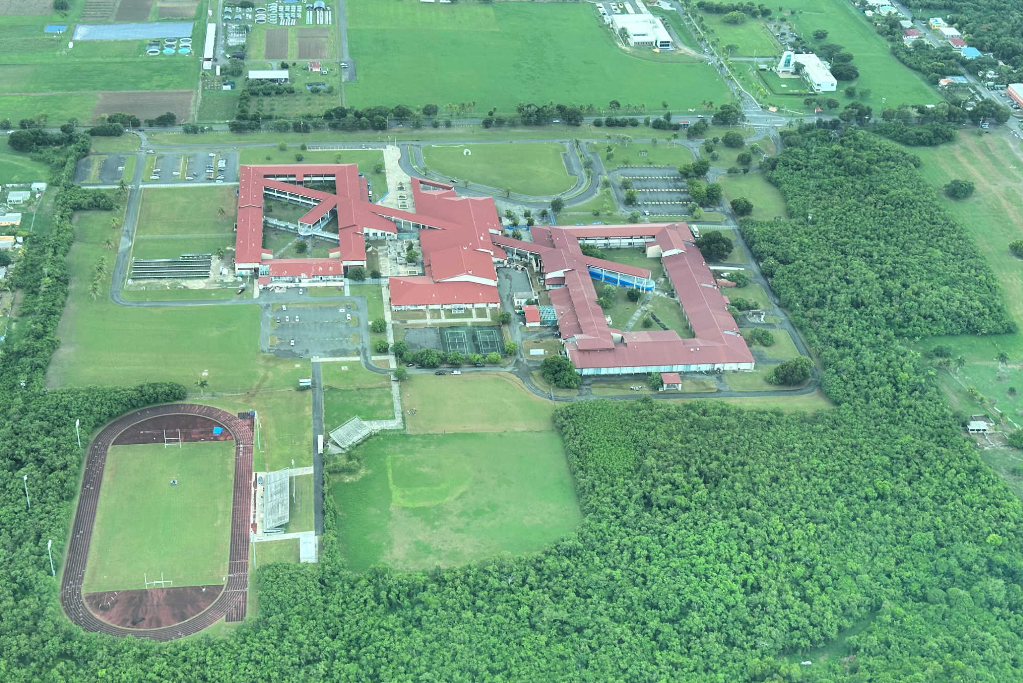 An aerial view of the SCEC campus, showing multiple school buildings and surrounding grounds where education officials said critical technology infrastructure has been damaged by power outages and rodent infestations.