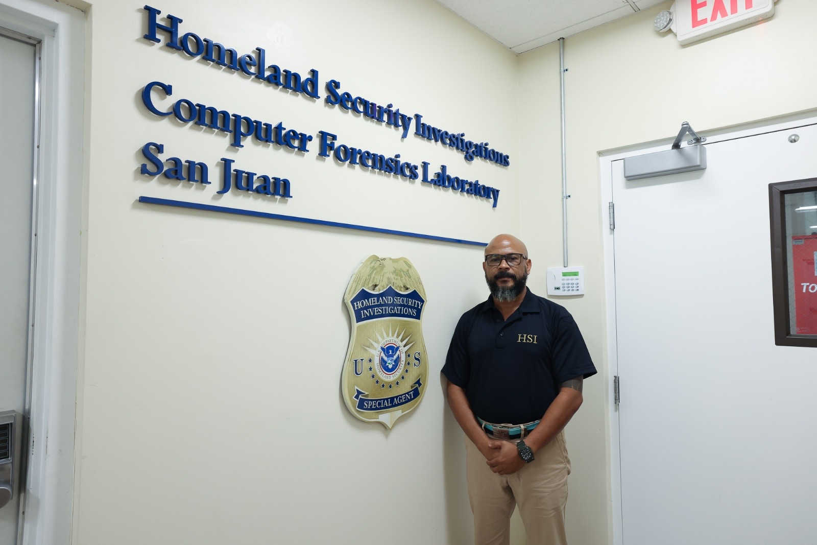 Army veteran and HSI computer forensic analyst Benjamin Rosario stands inside Homeland Security Investigations’ San Juan Computer Forensics Laboratory, where he helps process child exploitation cases.