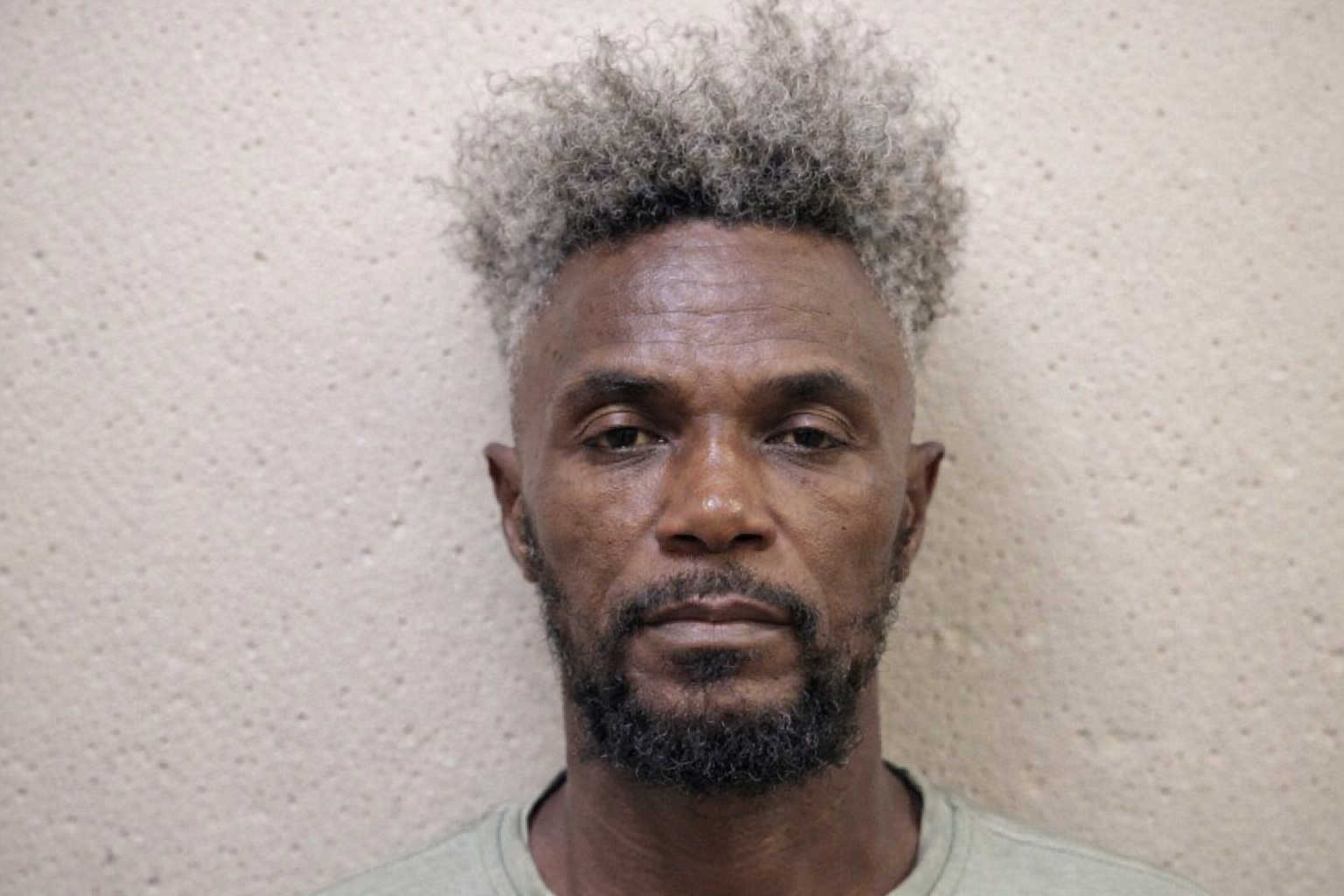 Mugshot of Jean Louis Gustave.