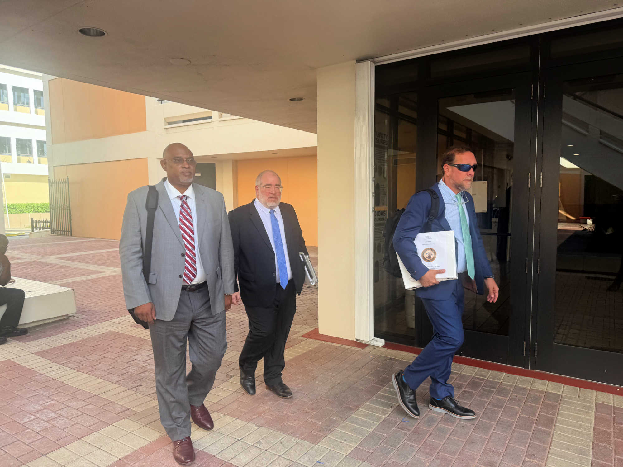 Former Police Commissioner Ray Martinez, left, and his attorneys following the Dec. 3, 2025 opening trial in St. Thomas, USVI.