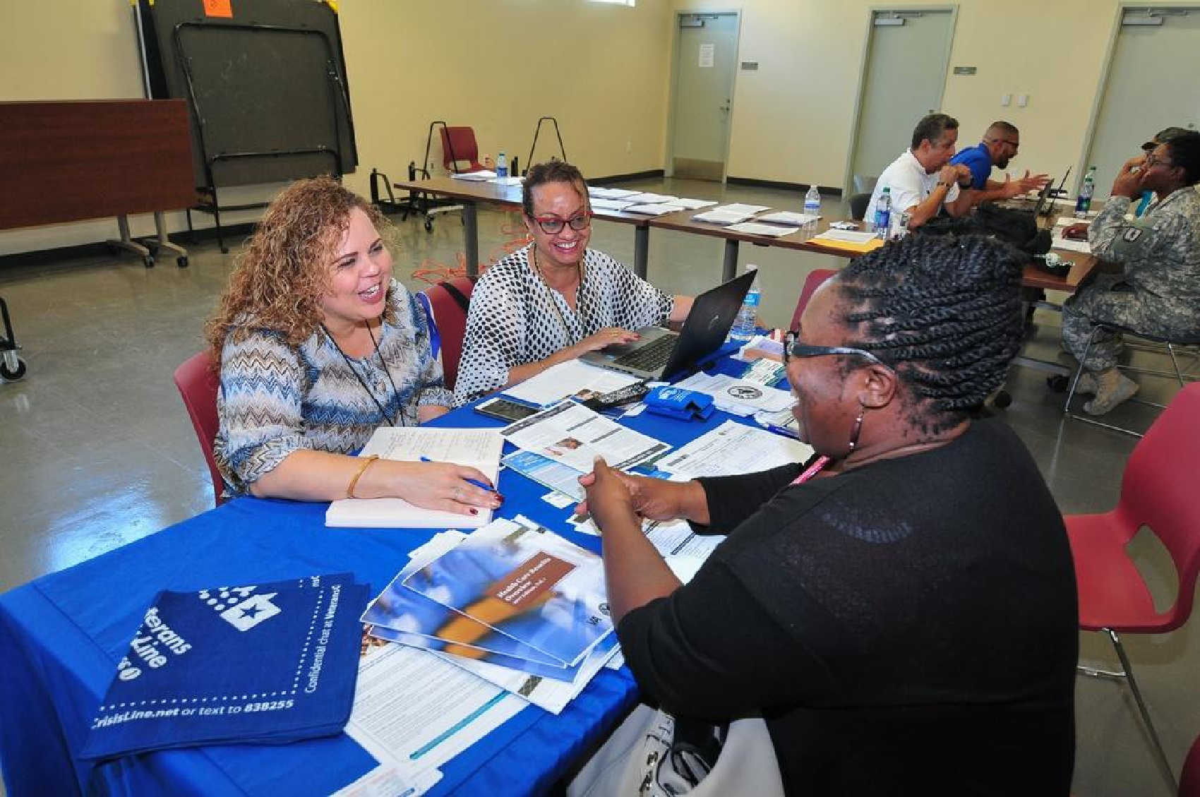 A U.S. Department of Veterans Affairs representative assists a veteran during an outreach event on St. Croix. The VA has awarded $651,572 to a local nonprofit to help Virgin Islands veterans facing housing insecurity.