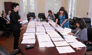 Government officials, bond counsel and staff prepare for a bond issue closing on the sale of $247 million of Gross Receipts Taxes Bonds. The closing took place at the offices of the V.I. Public Finance Authority on St. Thomas.