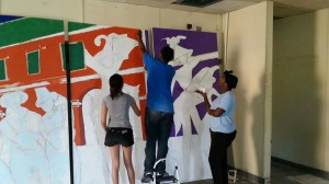 Children help with painting.