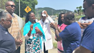 Dr. Michelle Davis and Property and Procurement Commissioner Randolph Bennett listen to the concerns of protesting EMS employees on Thursday afternoon.