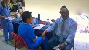 Government employee checking his blood pressure