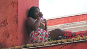 Abby Vidal enjoys a taste atop the Fort Frederik Museum. (Credit: Ernice Gilbert, VIC)