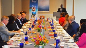Business leaders listen to Governor Kenneth Mapp speak in Atlanta.