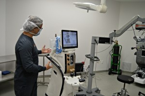 Dr. Jan B. Tawakol describing a state-of-the-art eye surgery machine.