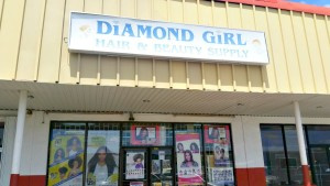 Diamond Girl Hair & Beauty Supply's entrance, located in the United Shopping Plaza.