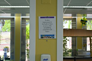 JFL cafeteria's mission statement displayed on a column within the cafeteria
