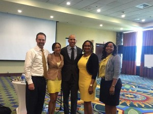 (L to R): Deputy Superintendent Michael Harrigan, District Director of School and Community Affairs Jerae Forde, Superintendent Dionne Wells-Hedrington and Deputy Superintendent Racquel Berry-Benjamin pose with Andres “The Cuban Guy” Lara (center) at the 5th Annual Parent Conference held at the Marriot Frenchman's Reef Hotel on St. Thomas on September 6.