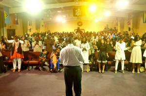 Pastor Dexter Skepple ministers to a capacity crowd on Old Year's Night, 2014 at Speak the Word Ministries, St. Croix.