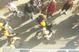 VIPD escorting a young man out of the festivities