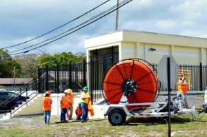 VINGN field employees work at a fiber access point on St. Croix