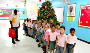 Actg Supt Hewitt with Andrews School kg students.
