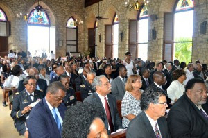 Funeral attendees listen as the family, friends and colleagues of Julio Anthony Brady gave remarks.