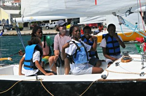 The USA’s Dave Perry (second from left/purple shirt) participates in the short Youth Regatta, as a part of the CAMR.