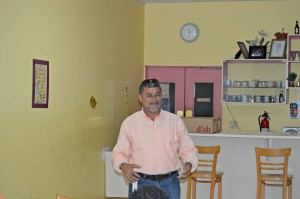 Leonardo Carrion addressing men at Bernie's Restaurant in Peter's Rest.