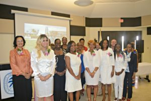 New nurses, the program's Dean of Nursing Dr. Beverley Anne Lansiquot, left, along with professors, at UVI's pinning ceremony on Wednesday.